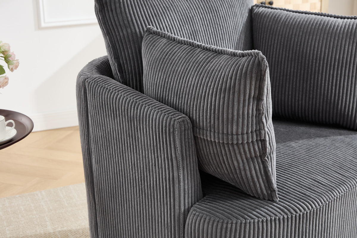 Grey corduroy barrel chair in a modern apartment setting