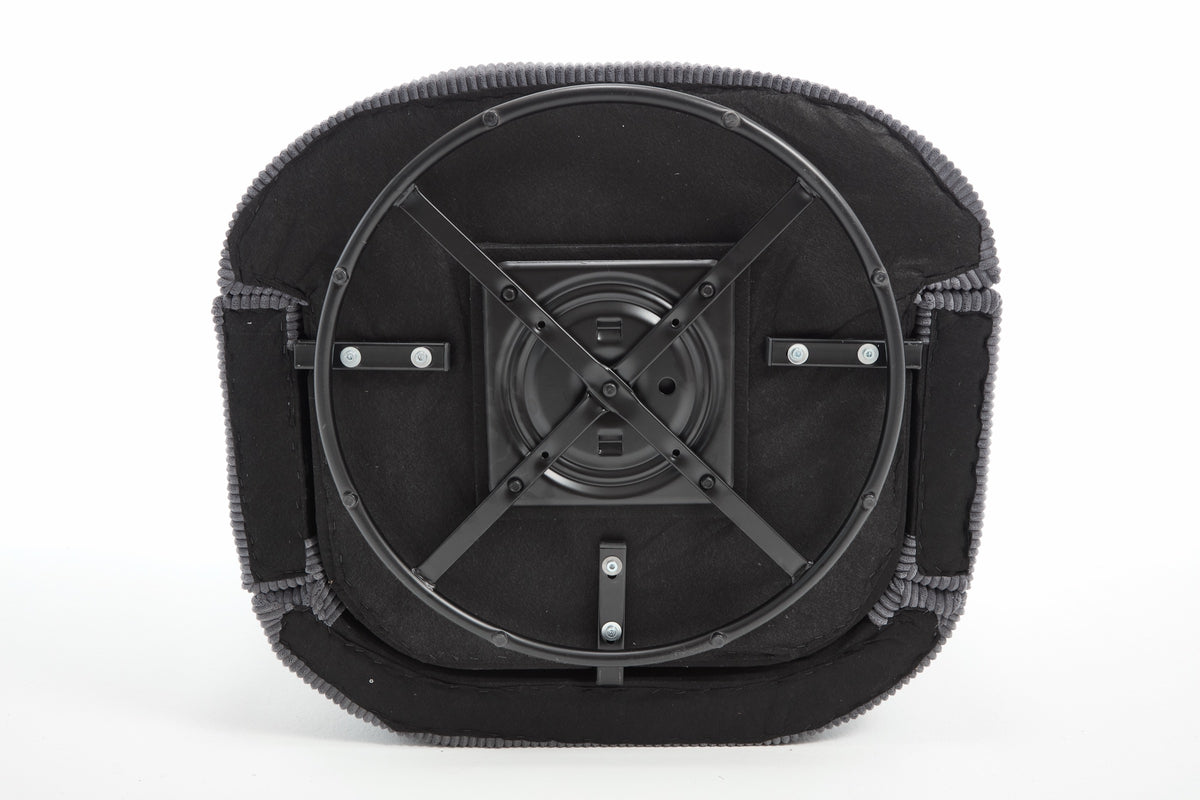 Corduroy barrel chair detail showing the seat cushion