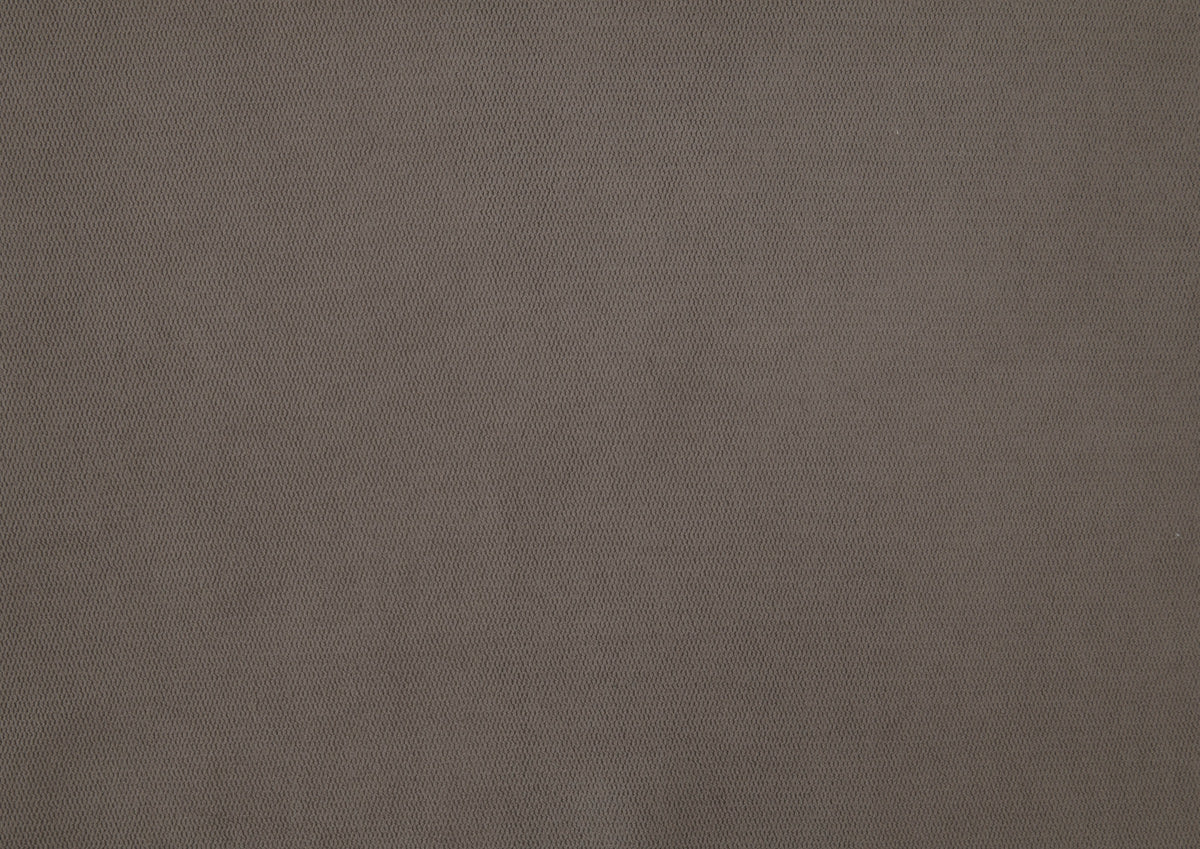 taupe barrel accent chair — in-use view