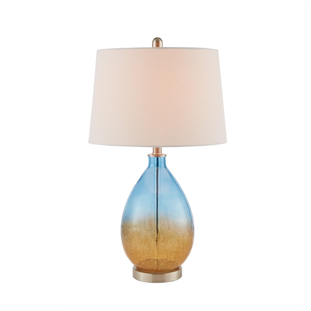 Ombre glass table lamp in a styled room