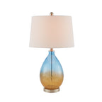 Ombre glass table lamp in a styled room